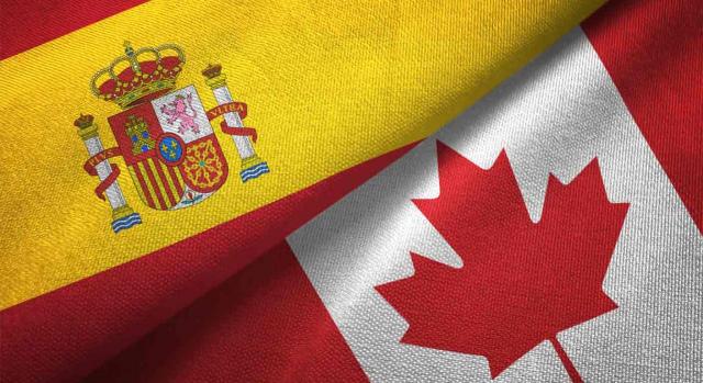 Cooperación. Banderas de España y Canadá
