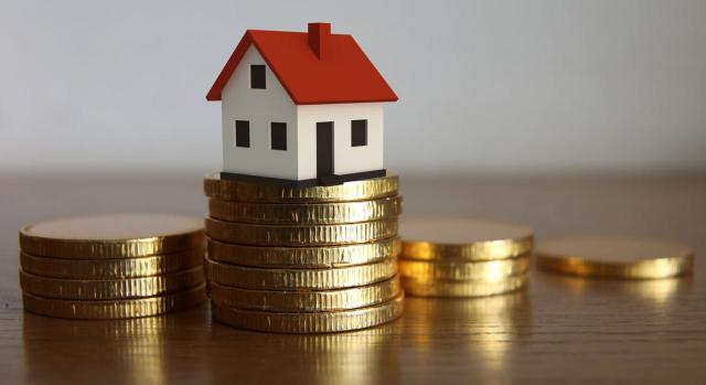 Contabilidad Contabilidad. Imagen de una casita sobre monedas